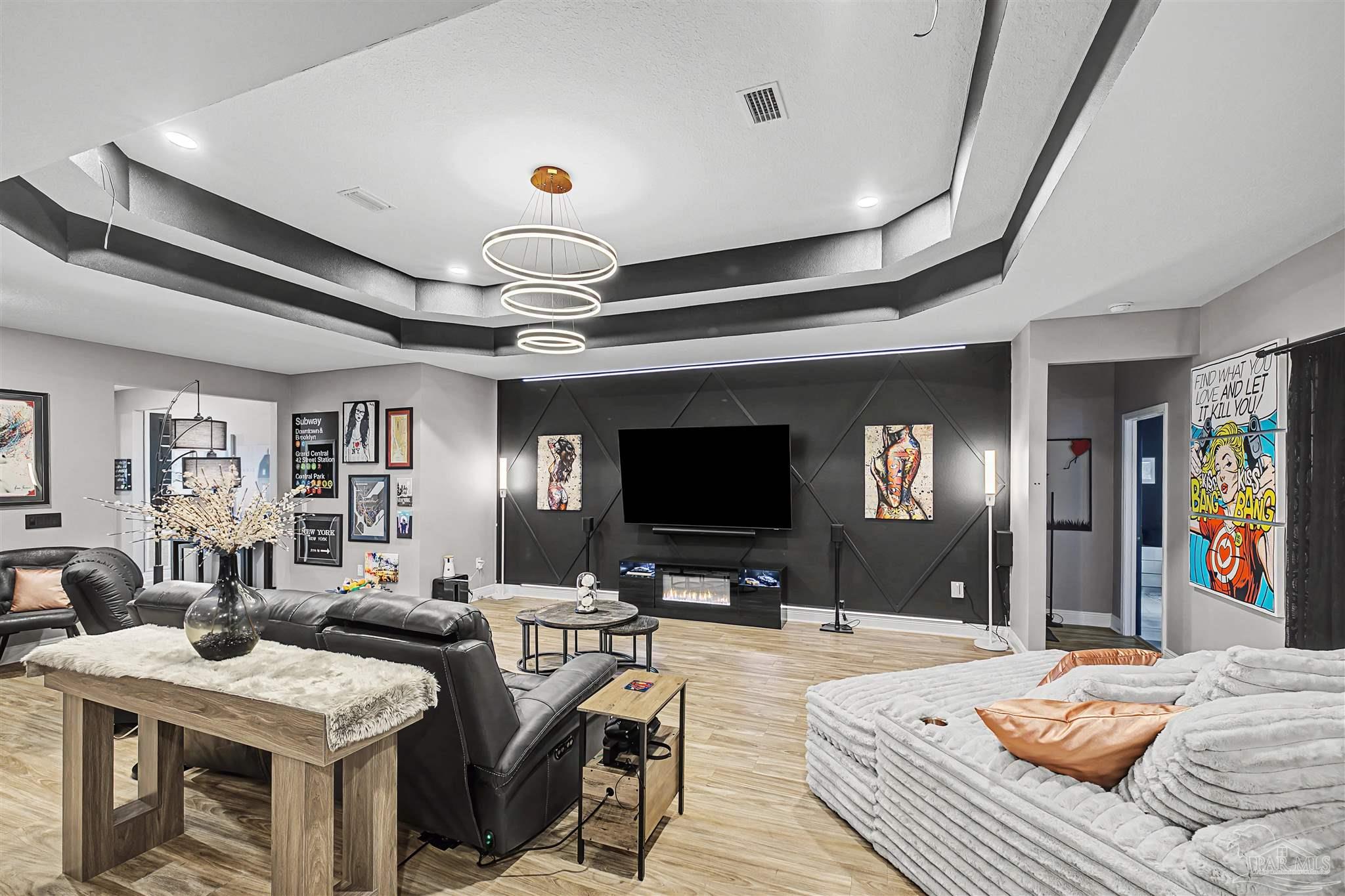 327 Cayden Way Cantonment, FL 32533 - Photo 14 of 64 a bedroom with furniture and a flat screen tv
