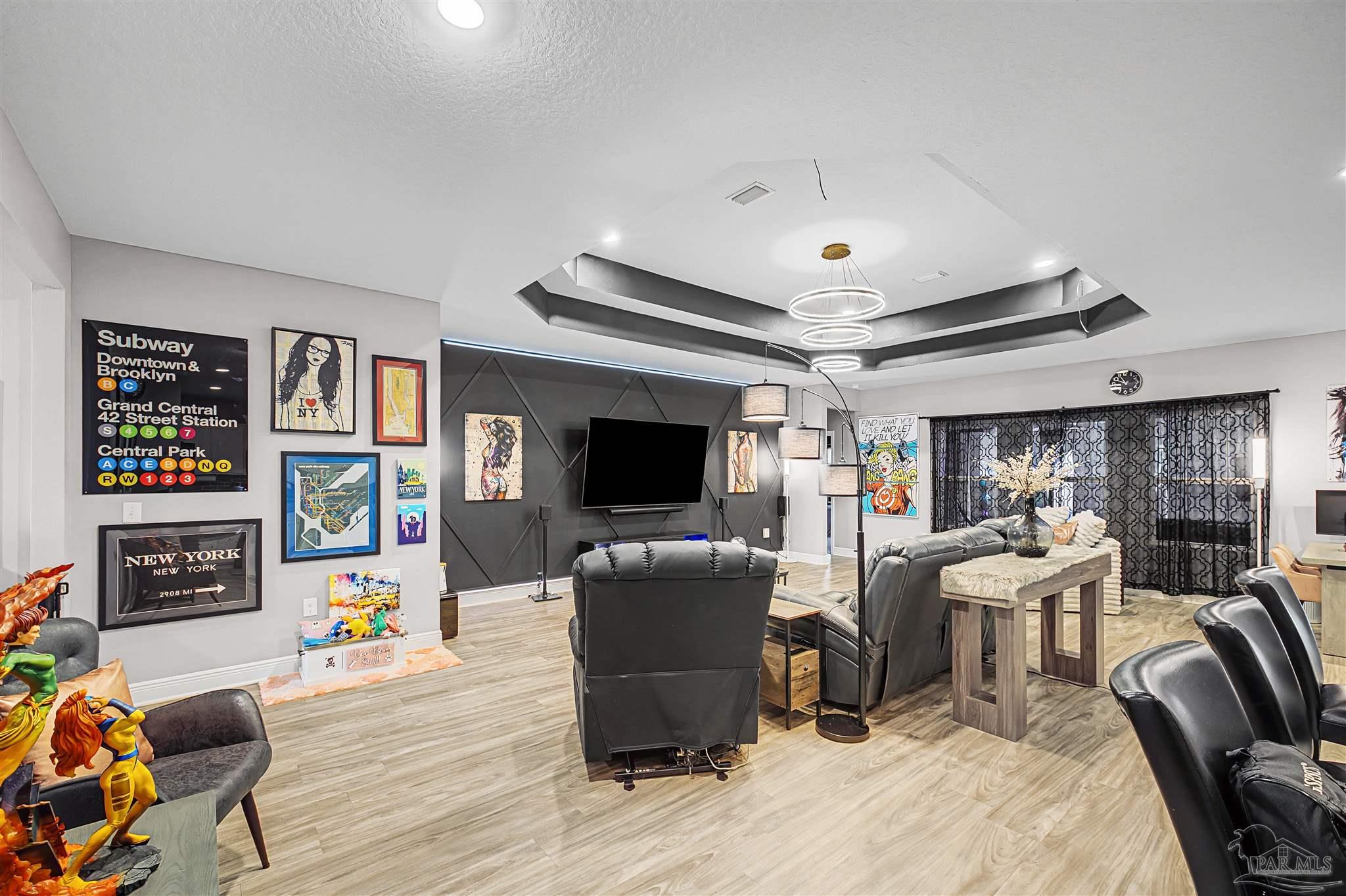 327 Cayden Way Cantonment, FL 32533 - Photo 17 of 64 a living room with furniture and a flat screen tv