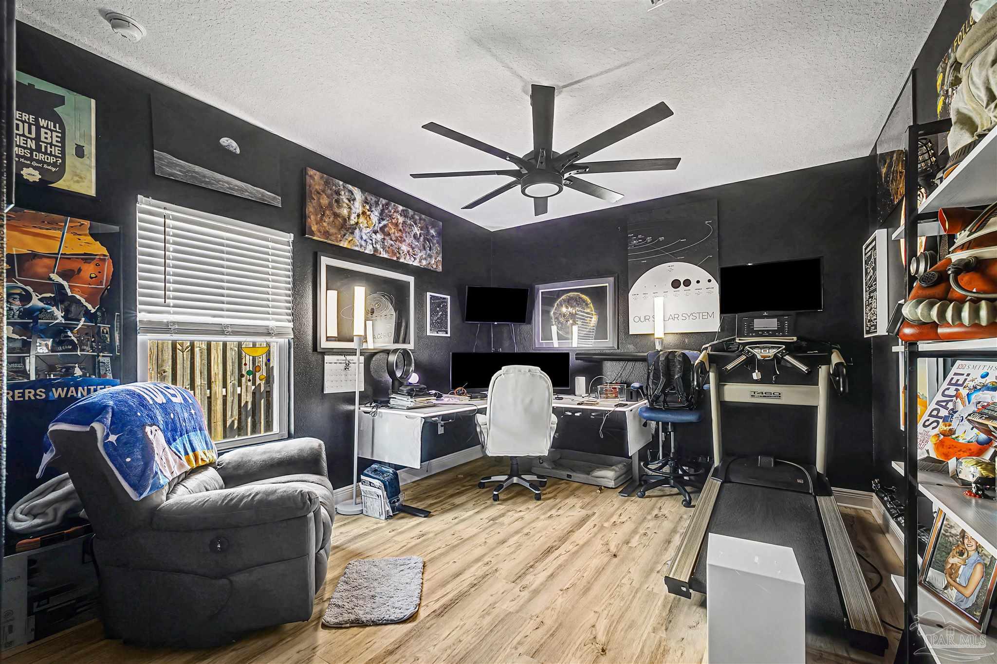 327 Cayden Way Cantonment, FL 32533 - Photo 28 of 64 a living room with furniture a fireplace and a flat screen tv