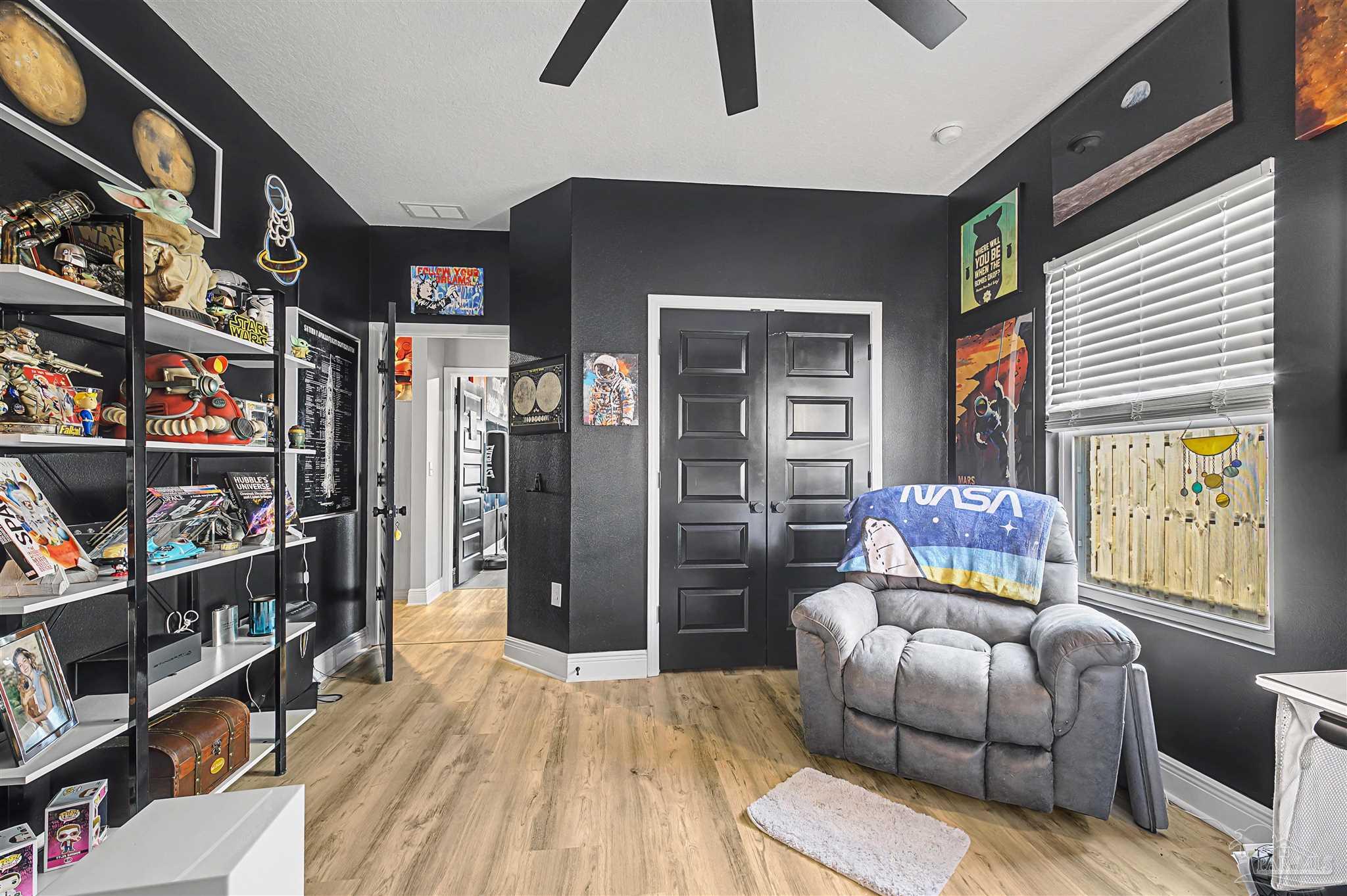 327 Cayden Way Cantonment, FL 32533 - Photo 29 of 64 a bedroom with furniture and a book shelf