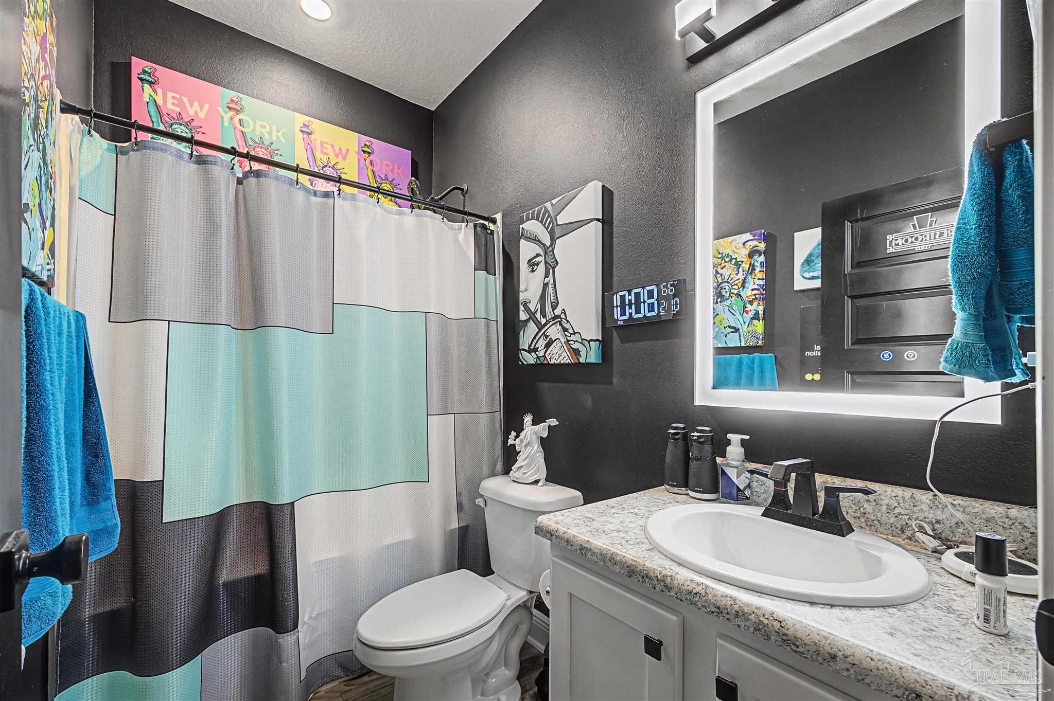 327 Cayden Way Cantonment, FL 32533 - Photo 32 of 64 a bathroom with a granite countertop sink toilet and shower