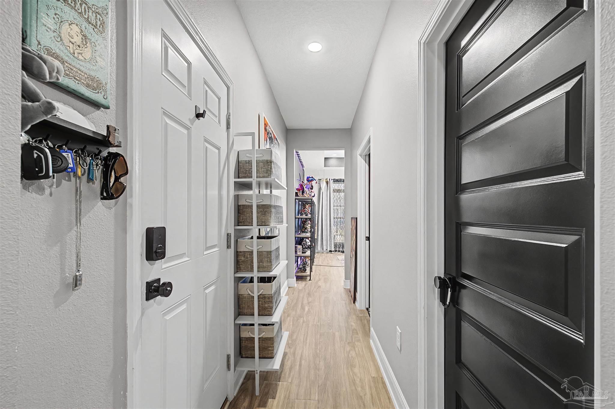 327 Cayden Way Cantonment, FL 32533 - Photo 33 of 64 a view of walk in closet with clothes and shoes