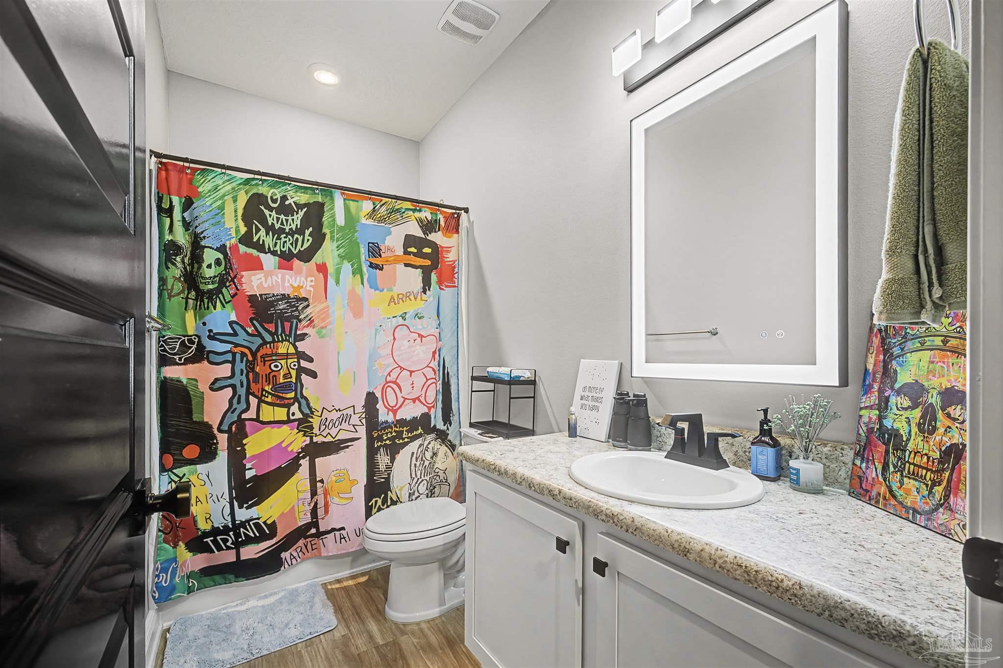 327 Cayden Way Cantonment, FL 32533 - Photo 34 of 64 a bathroom with a granite countertop sink and a mirror