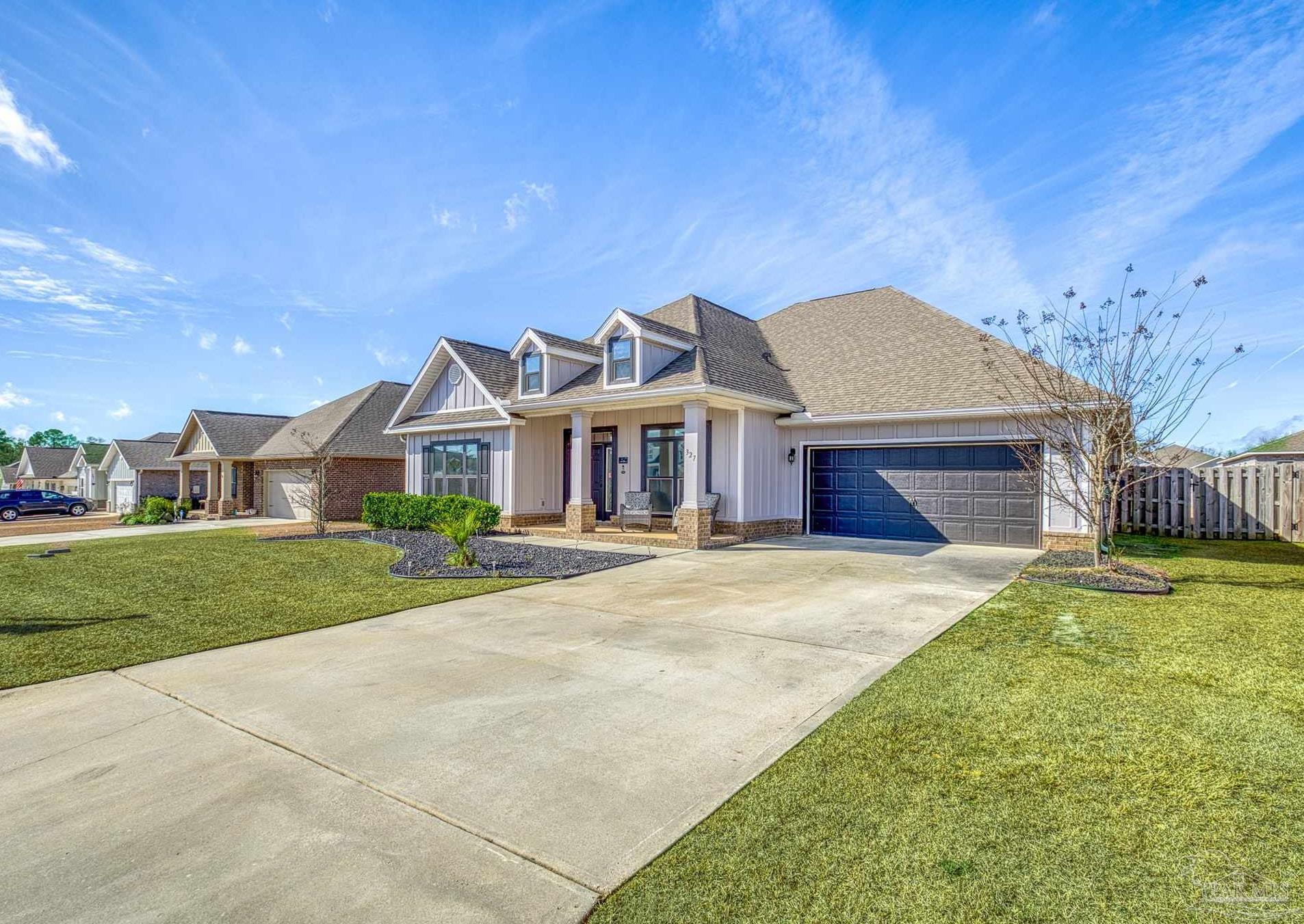 327 Cayden Way Cantonment, FL 32533 - Photo 39 of 64 a front view of a house with a yard