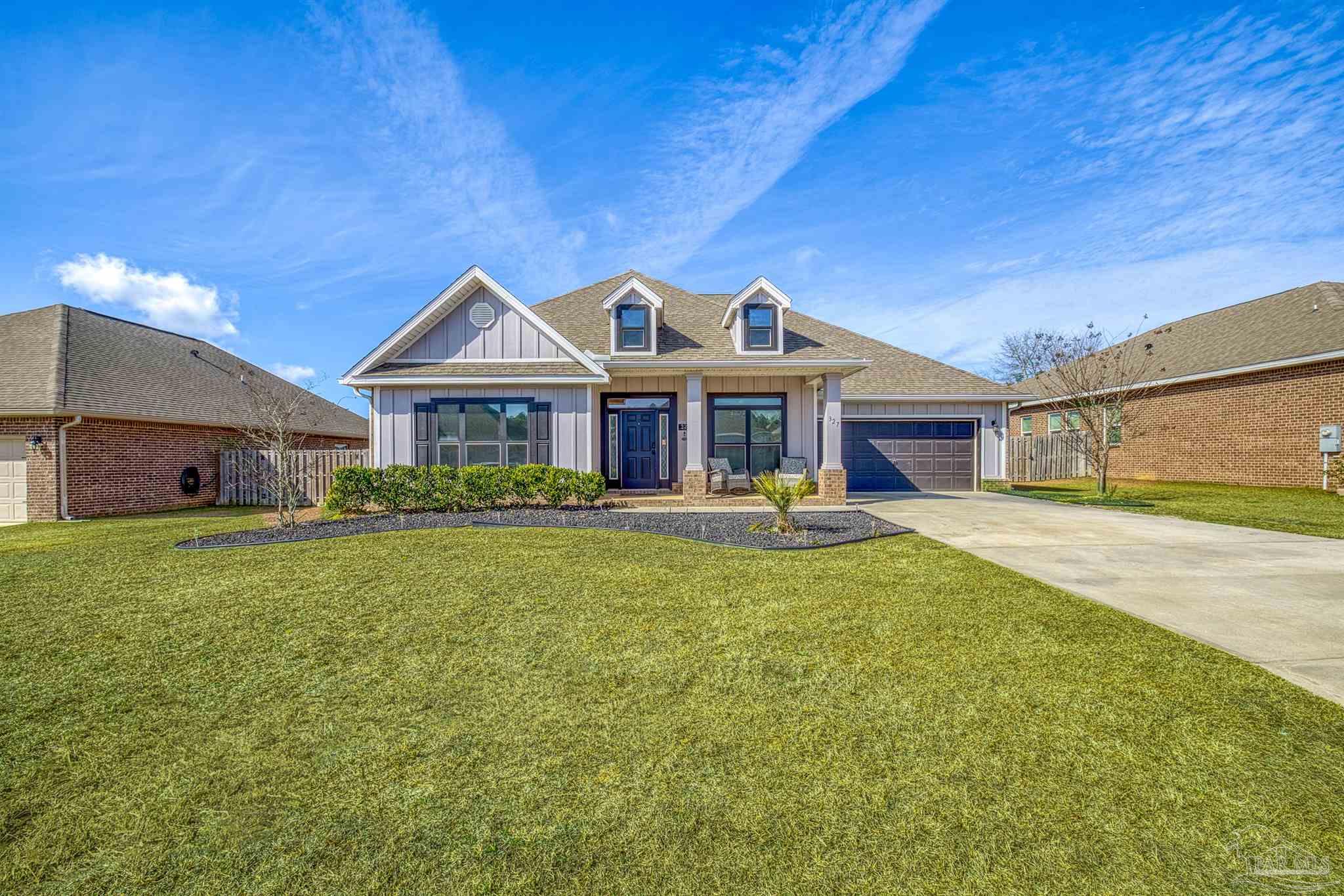 327 Cayden Way Cantonment, FL 32533 - Photo 41 of 64 a front view of a house with garden