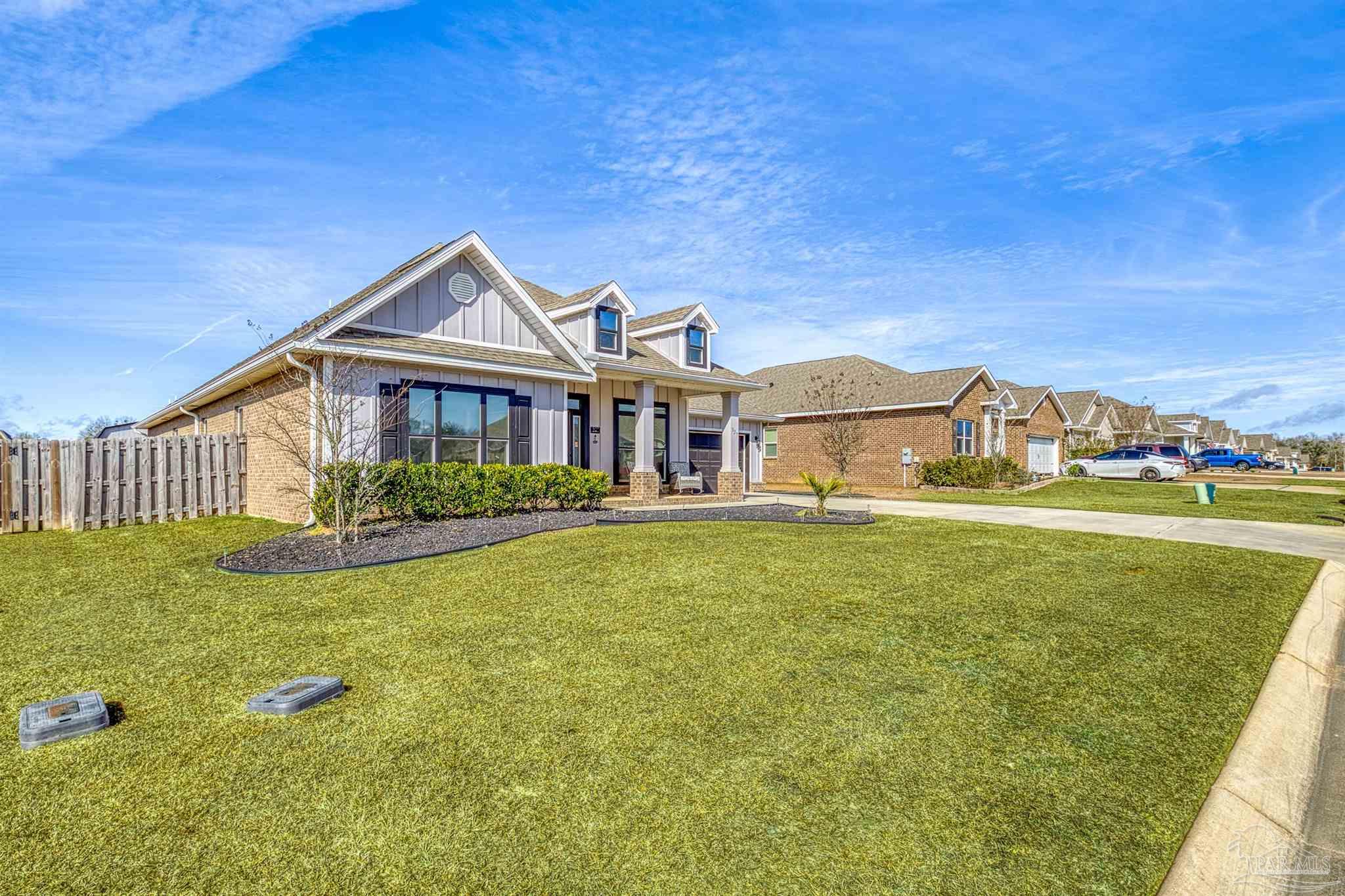 327 Cayden Way Cantonment, FL 32533 - Photo 42 of 64 a front view of a house with garden