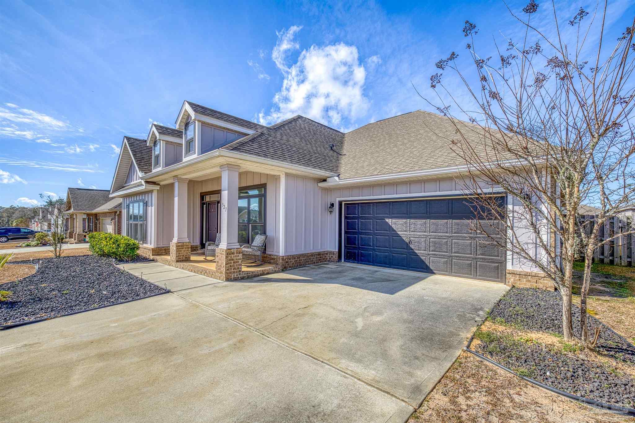 327 Cayden Way Cantonment, FL 32533 - Photo 46 of 64 a view of a house with a yard and garage