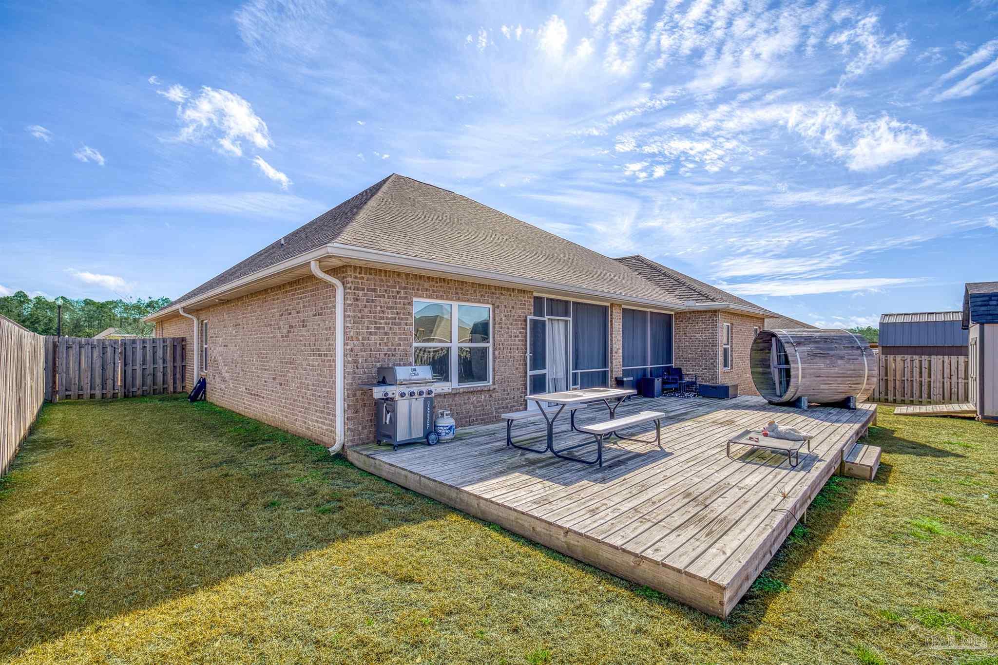 327 Cayden Way Cantonment, FL 32533 - Photo 47 of 64 a view of a house with backyard and sitting area