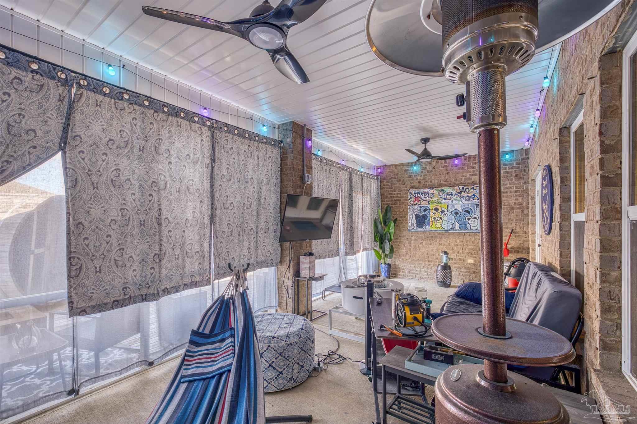 327 Cayden Way Cantonment, FL 32533 - Photo 51 of 64 a living room with furniture and a wooden floor