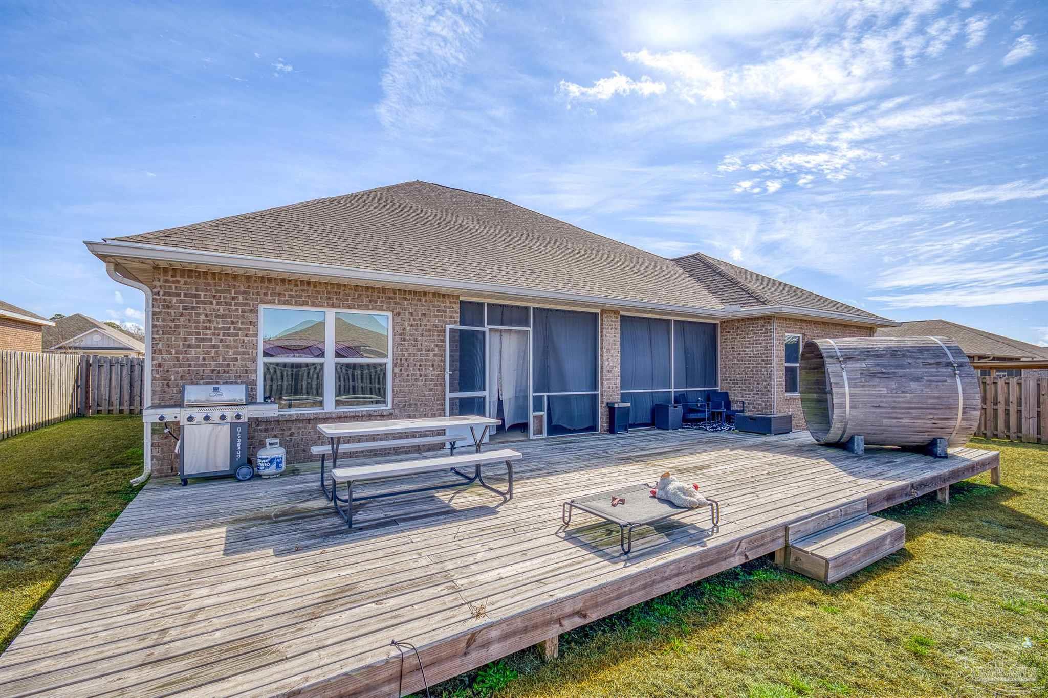 327 Cayden Way Cantonment, FL 32533 - Photo 54 of 64 a view of house with yard outdoor seating area and furniture