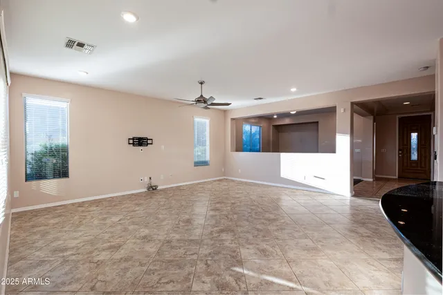 a view of a kitchen with a sink and stainless steel appliances