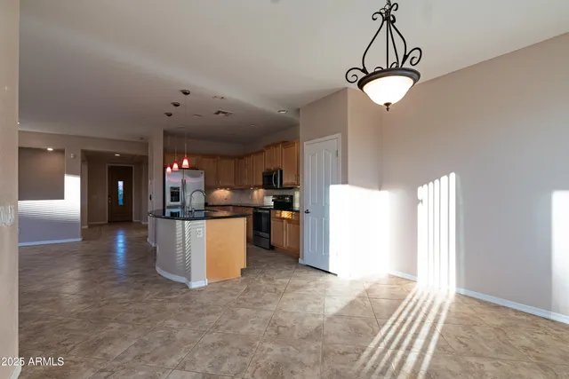 a view of a kitchen with appliances and cabinets