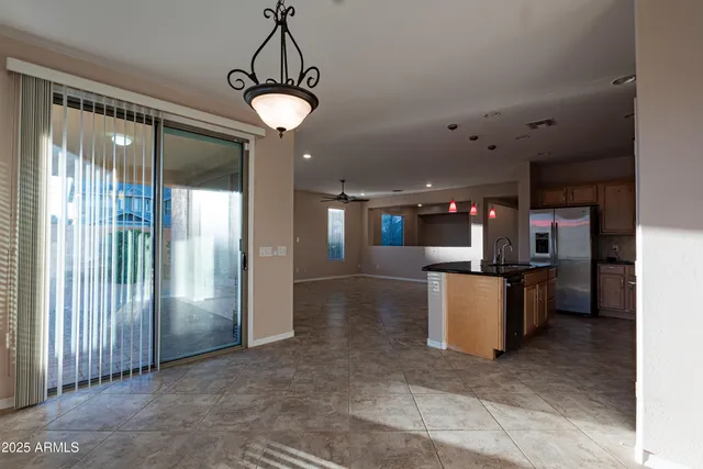 a view of a kitchen with a sink and a window