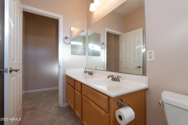 a view of a hallway with wooden shelves