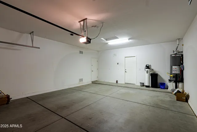 a view of potted plants in backyard of house