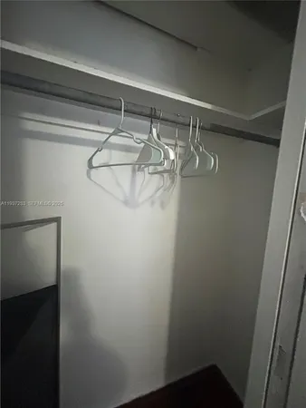 a view of a room with racks on the wall