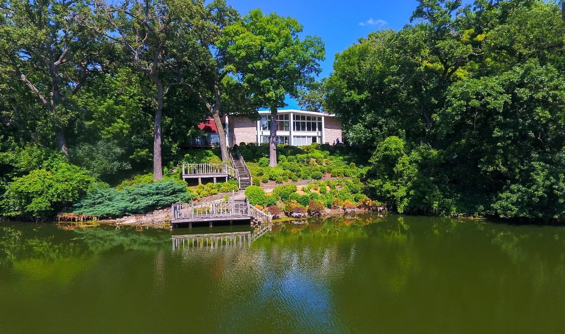 231 West County Line Road Barrington Hills, IL 60010 - Photo 1 of 35 a view of house with swimming pool yard and trees in the background
