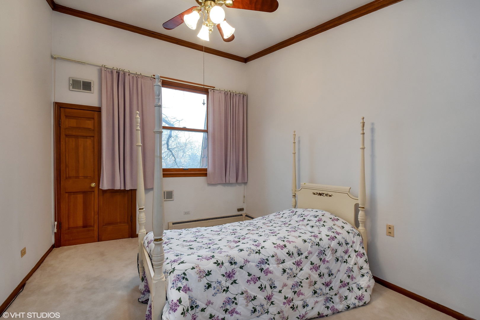 231 West County Line Road Barrington Hills, IL 60010 - Photo 23 of 35 a bedroom with a bed and a chandelier