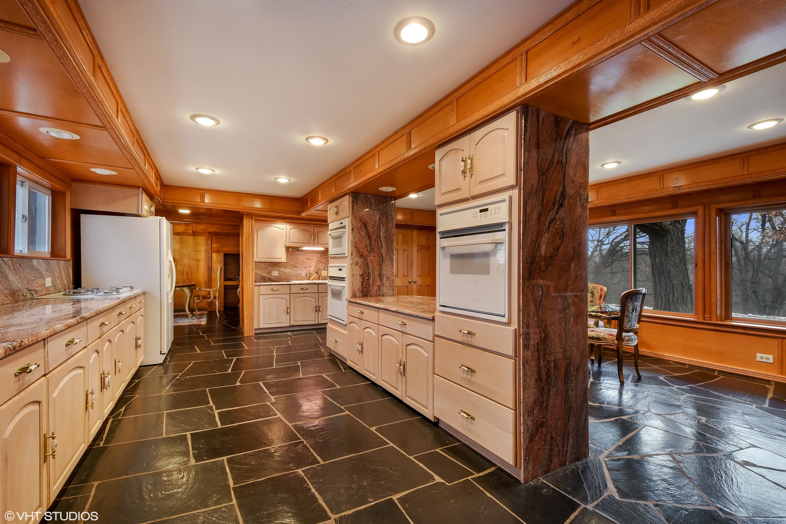 231 West County Line Road Barrington Hills, IL 60010 - Photo 9 of 35 a kitchen with cabinets and wooden floor
