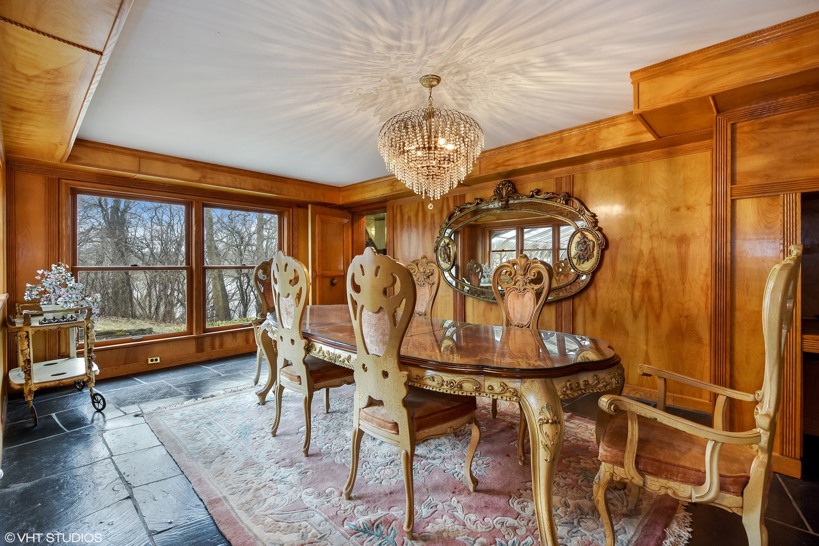 231 West County Line Road Barrington Hills, IL 60010 - Photo 10 of 35 a view of a dining room with furniture wooden floor and chandelier