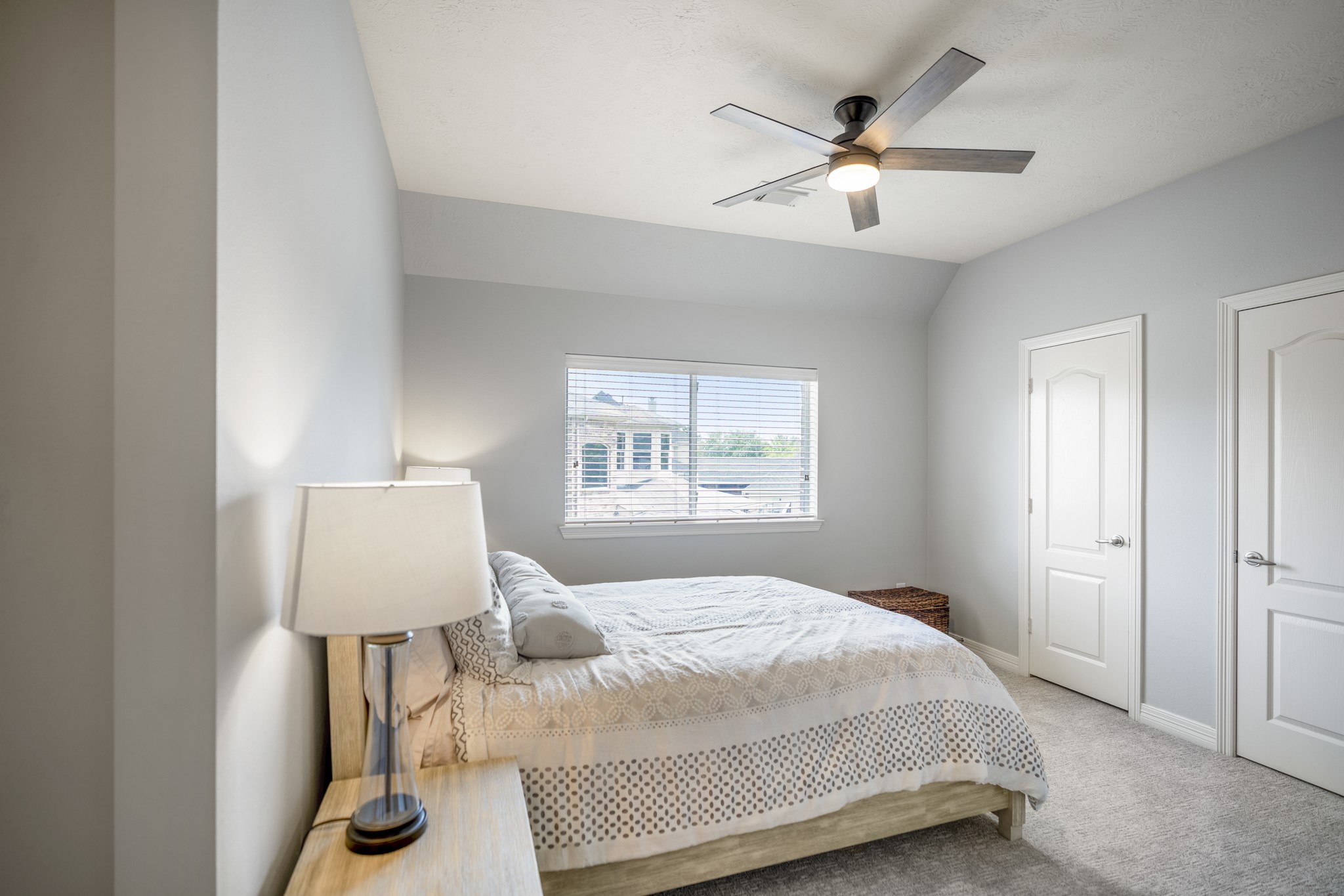 9707 Blue Cruls Way Spring, TX 77379 - Photo 39 of 50 a bedroom with a bed and a window