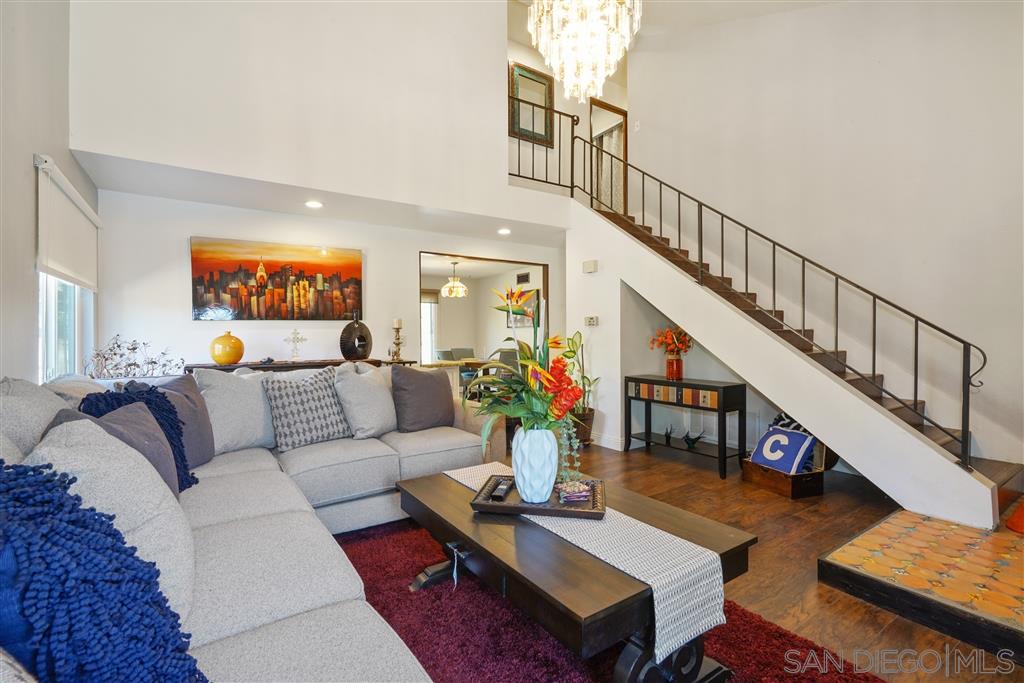 2305 Doubletree Road Spring Valley, CA 91978 - Photo 2 of 22 Warm and inviting living space with rich hardwood floors, fireplace and beautiful custom tile work.