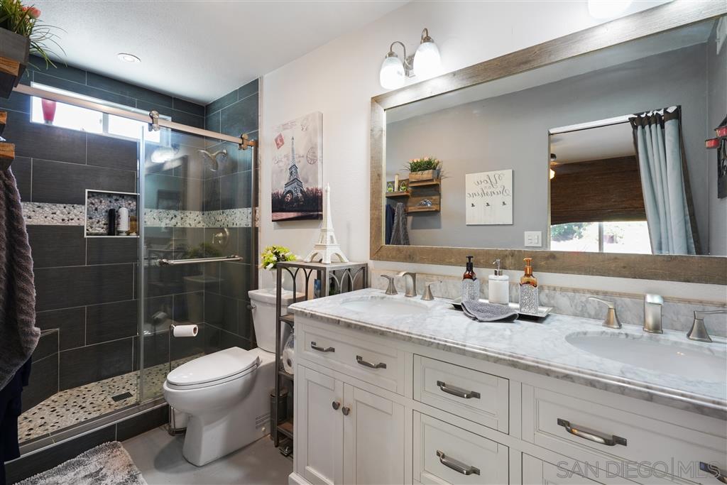 2305 Doubletree Road Spring Valley, CA 91978 - Photo 9 of 22 Remodeled Master bath with dual vanities and spacious shower.