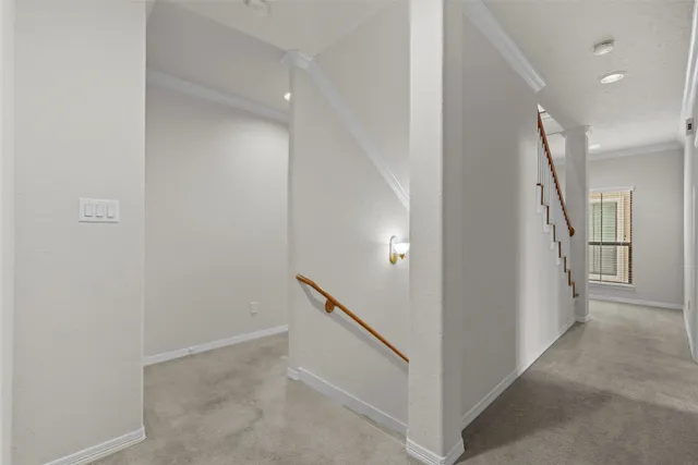 a view of a hallway with staircase