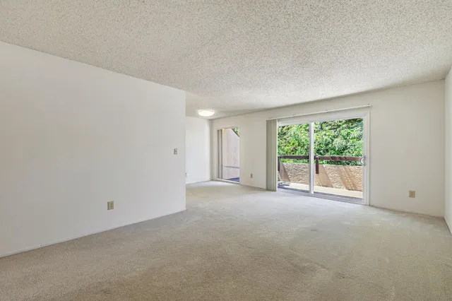 a utility room with cabinets washer and dryer