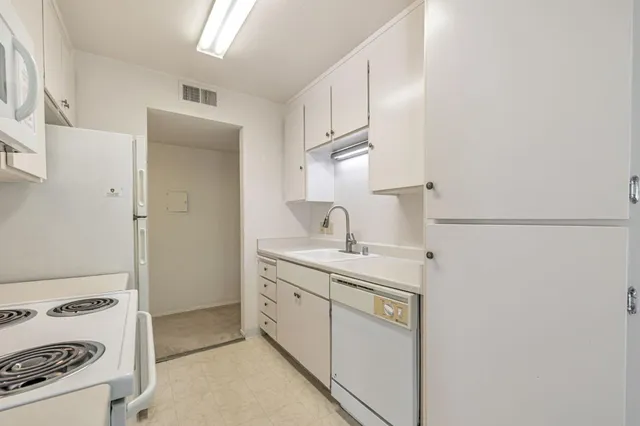 a kitchen with a sink and a window