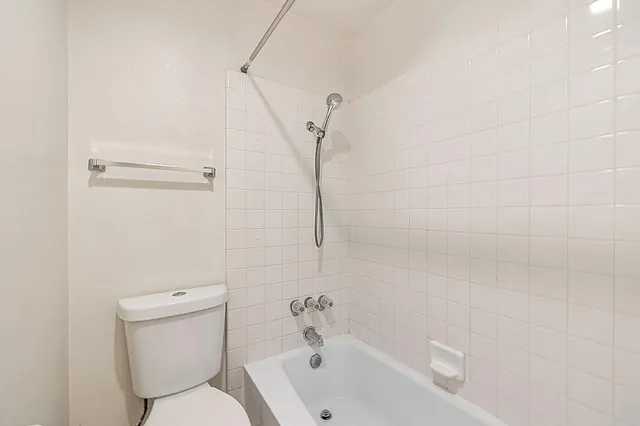a view of a balcony with wooden floor