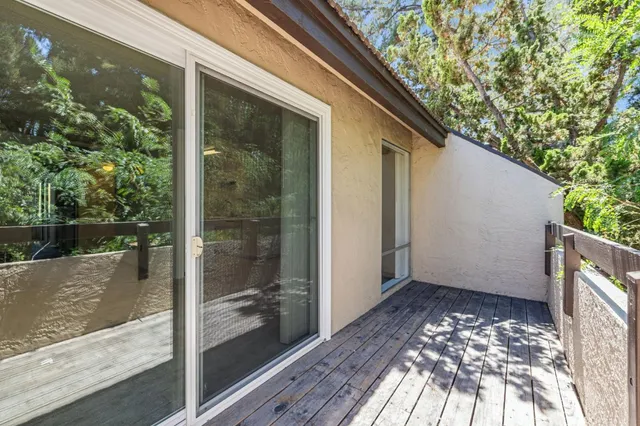 a view of balcony with wooden floor