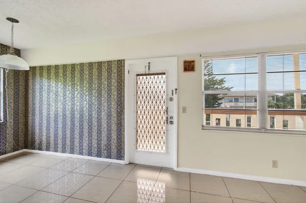a view of an empty room with a window