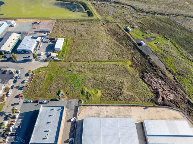 a view of a yard with an ocean view