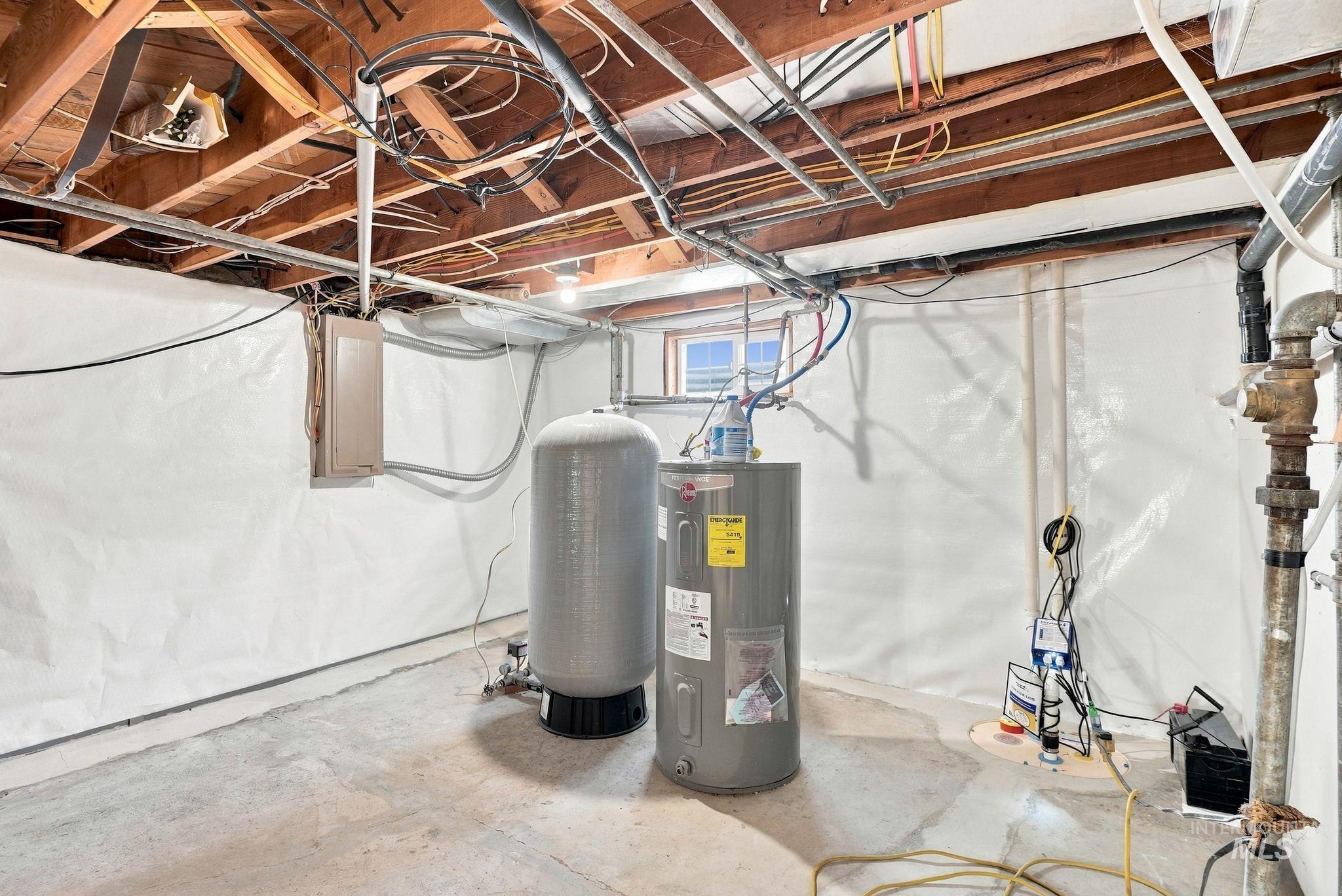 16078 Hoffman Road Kendrick, ID 83537 - Photo 25 of 47 Exposed ceiling joists, concrete flooring, hot water tank, and pressure tank