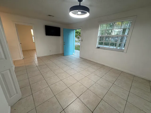 a view of an empty room with a window