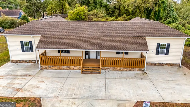 a view of a house with a fence