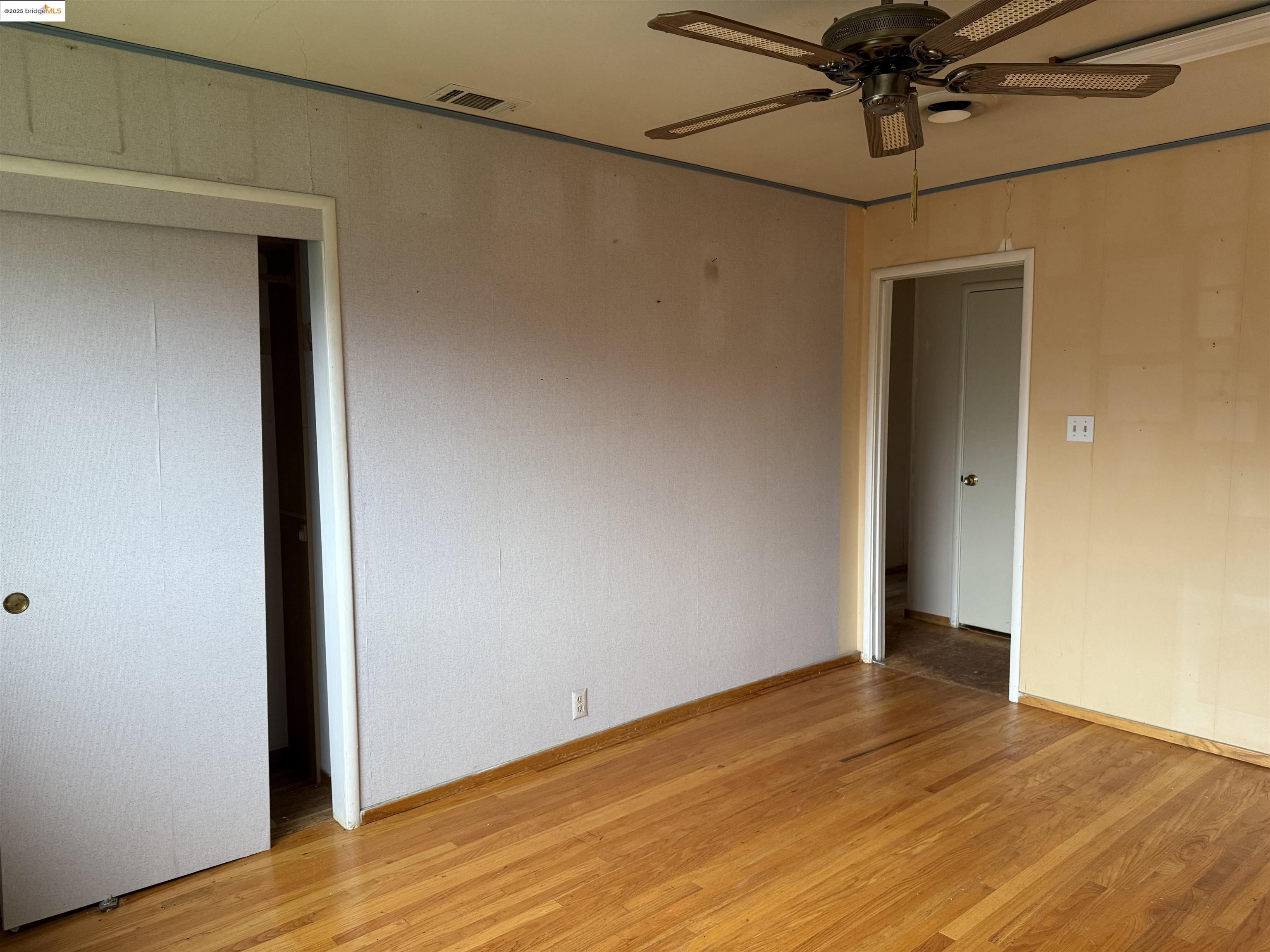 949 Flores Way Rio Vista, CA 94571 - Photo 11 of 19 a view of a room with wooden floor and a window