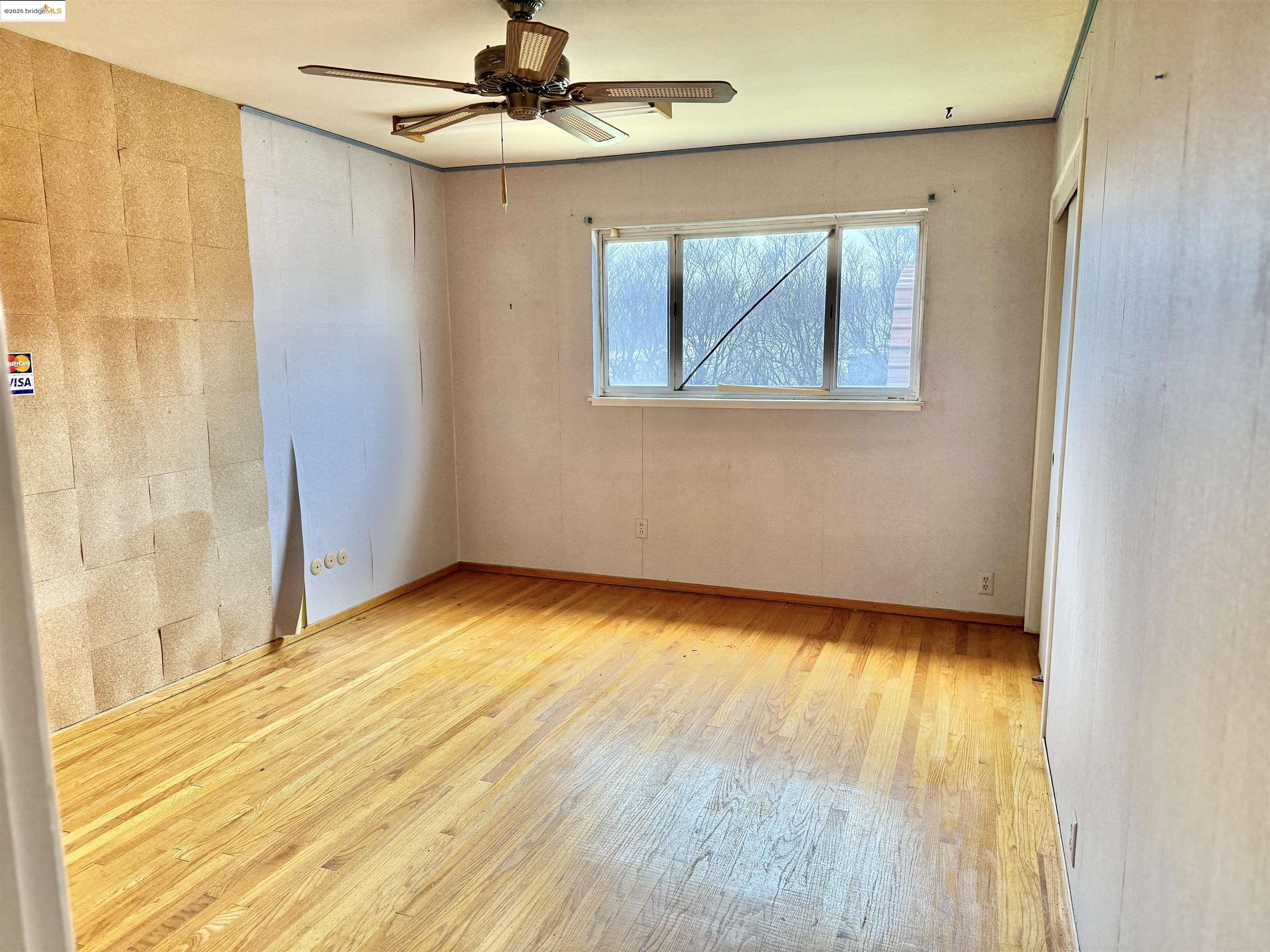 949 Flores Way Rio Vista, CA 94571 - Photo 12 of 19 a view of empty room with wooden floor and fan