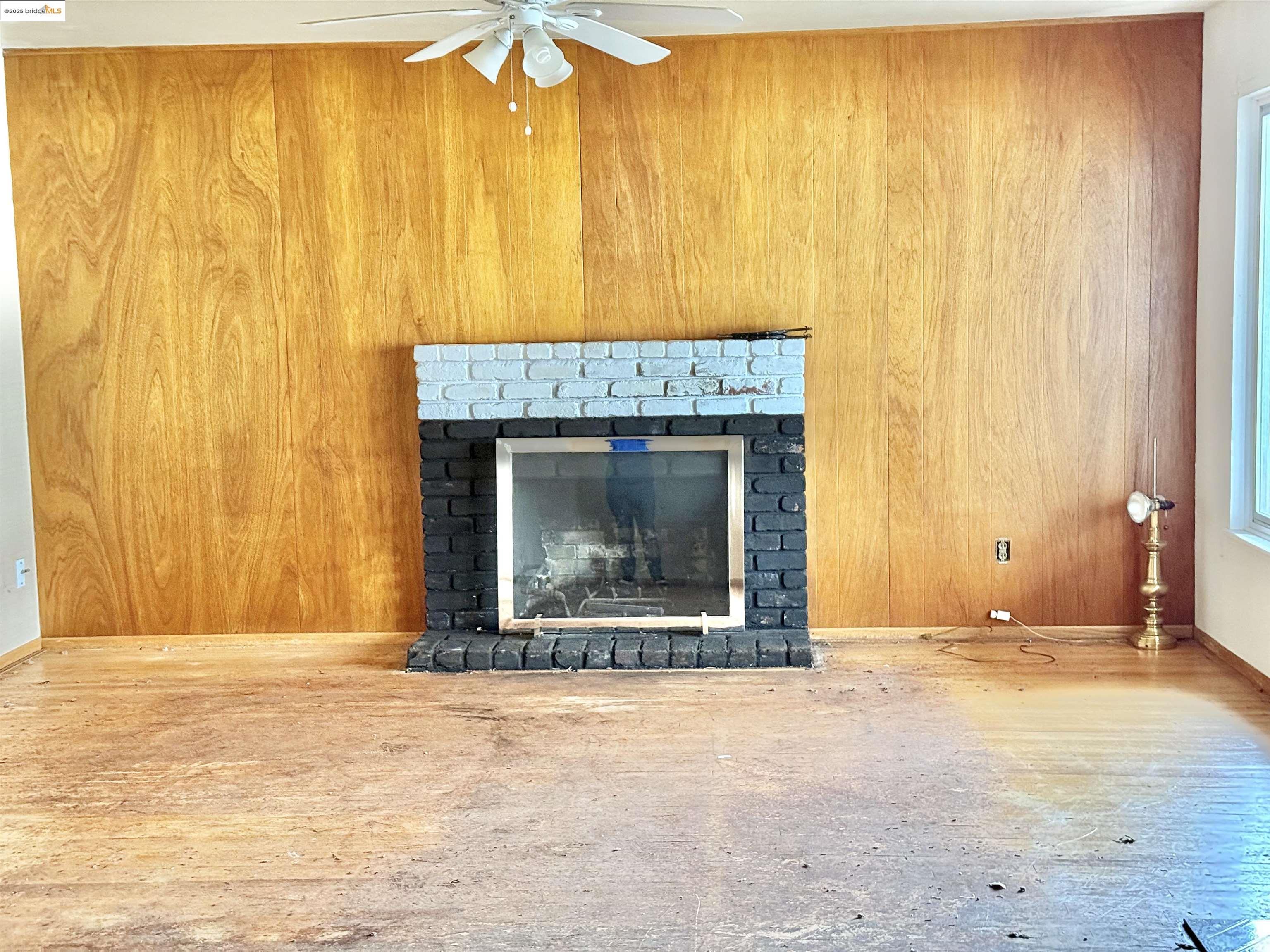 949 Flores Way Rio Vista, CA 94571 - Photo 4 of 19 a view of an empty room with a fireplace and a window
