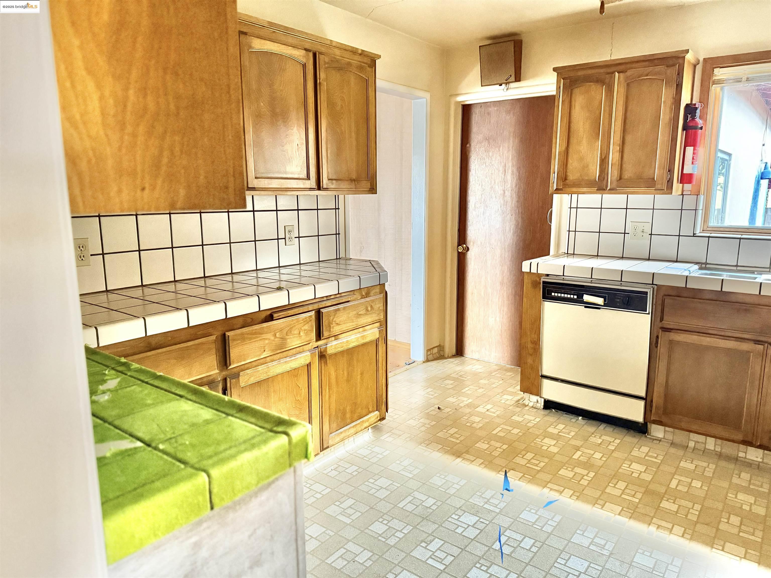 949 Flores Way Rio Vista, CA 94571 - Photo 9 of 19 a view of a kitchen with wooden floor and a refrigerator