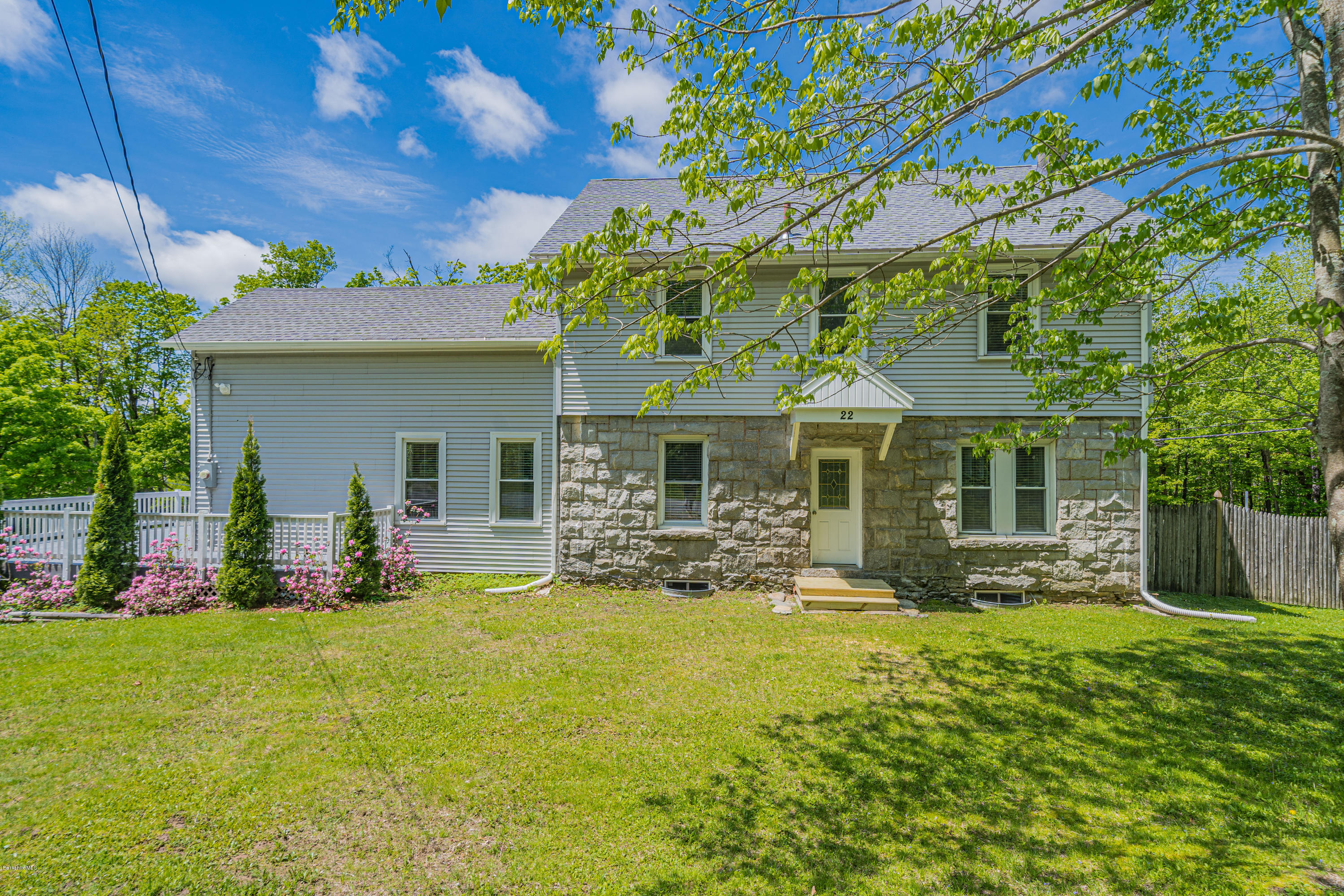 22 Wade Inn Road Becket, MA 01223 - Photo 2 of 32 a front view of a house with garden