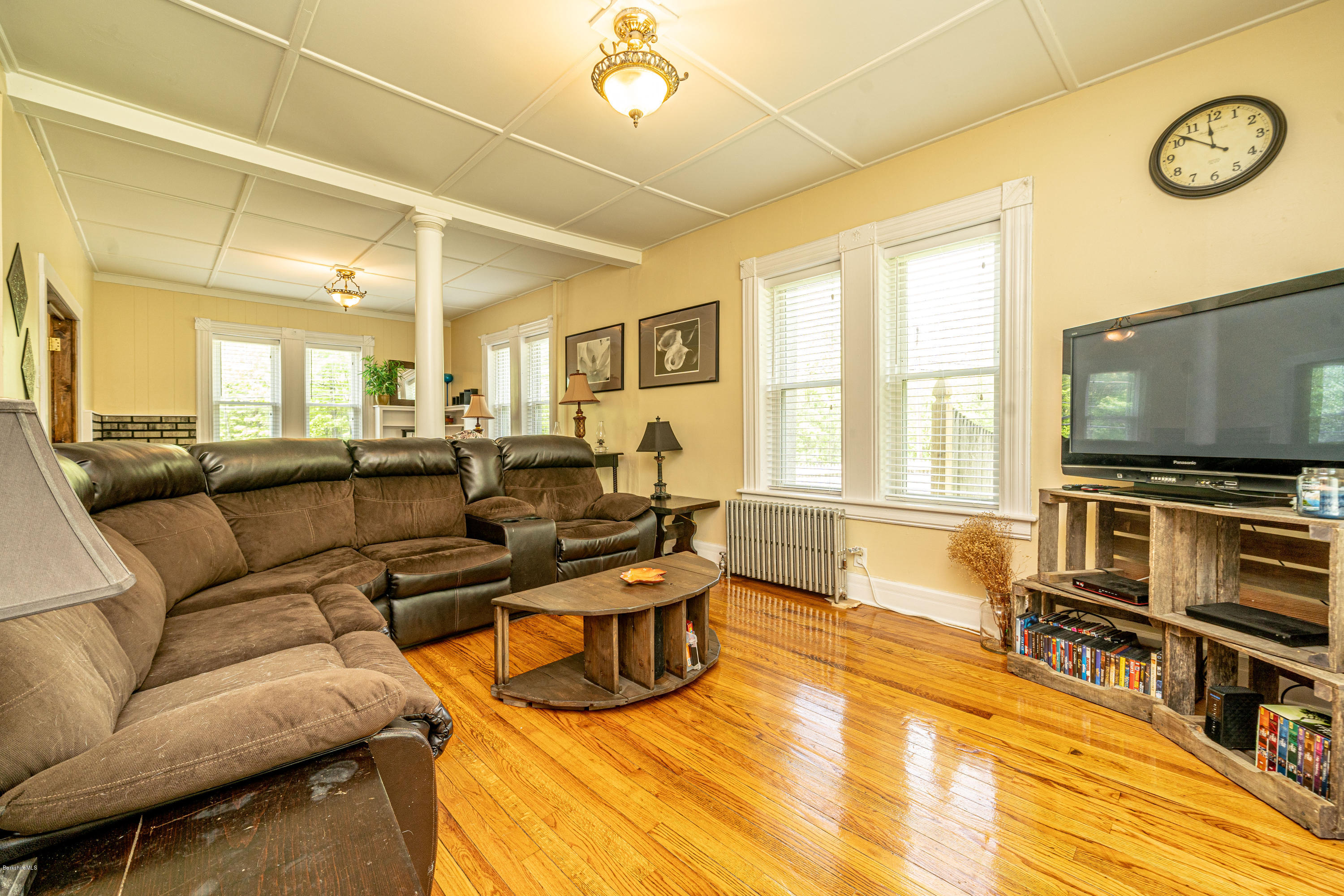 22 Wade Inn Road Becket, MA 01223 - Photo 15 of 32 a living room with furniture and a flat screen tv