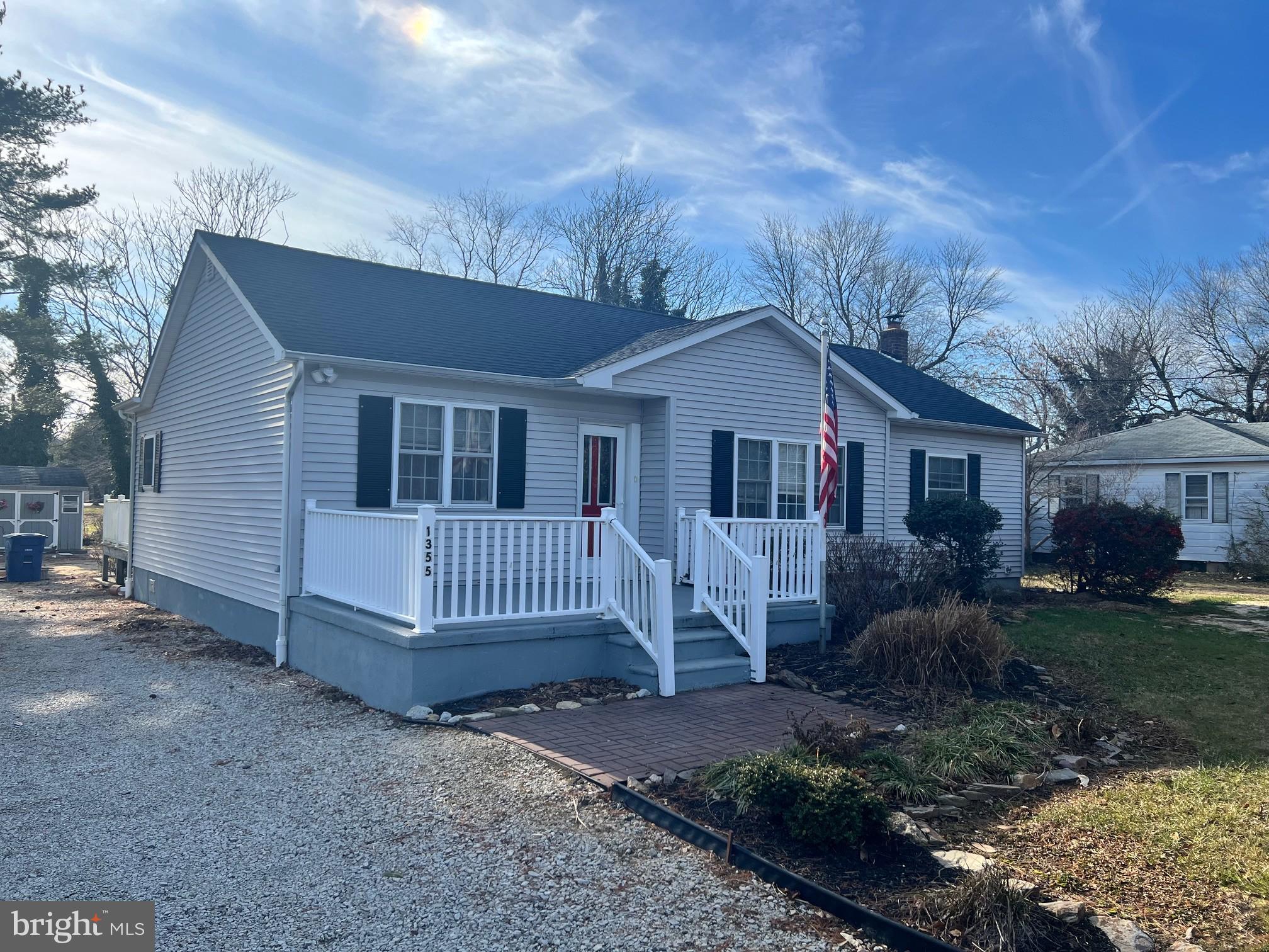 a view of house with a yard
