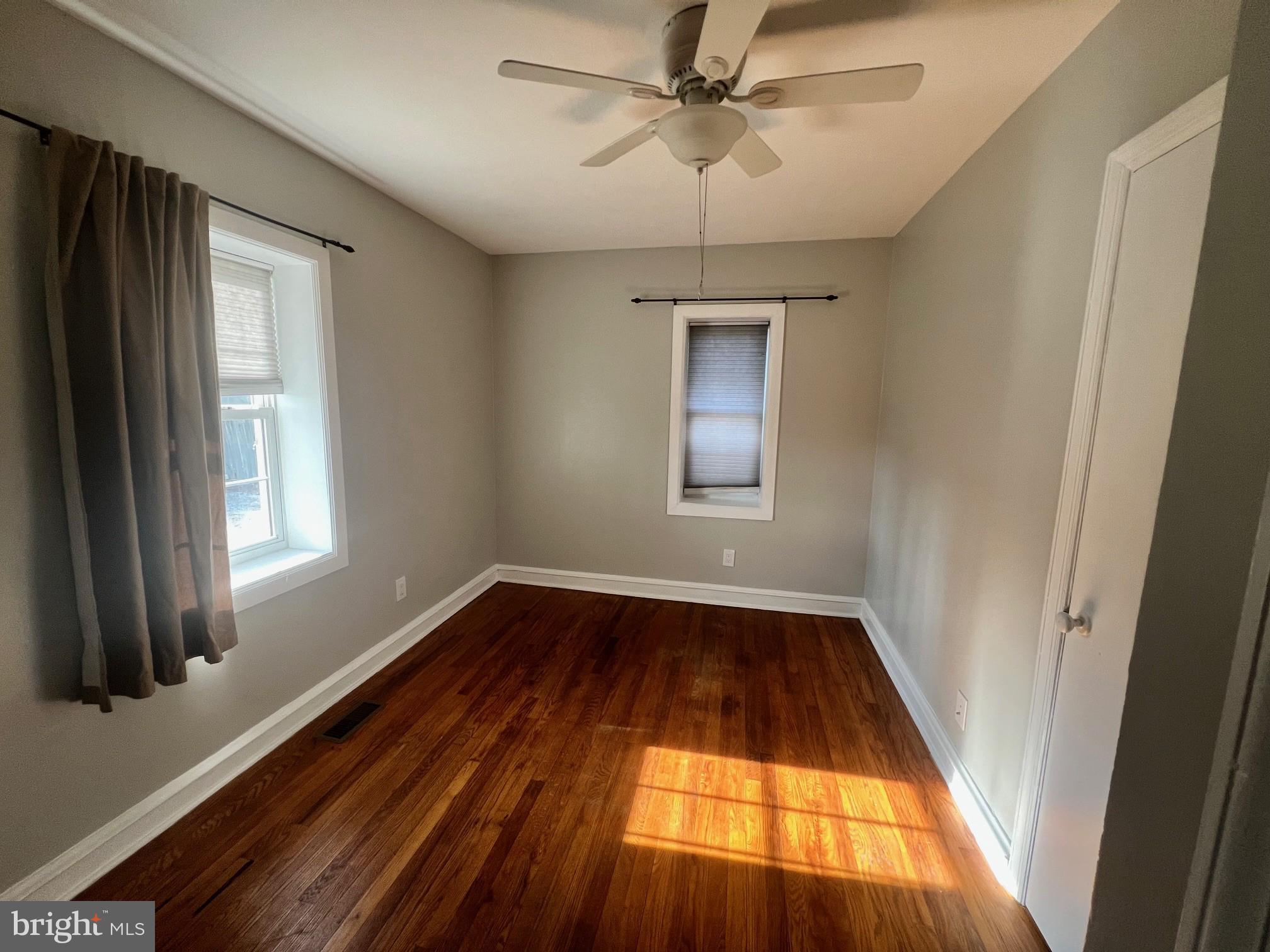 1355 Harding Highway Newfield, NJ 08344 - Photo 14 of 18 wooden floor in an empty room with a window