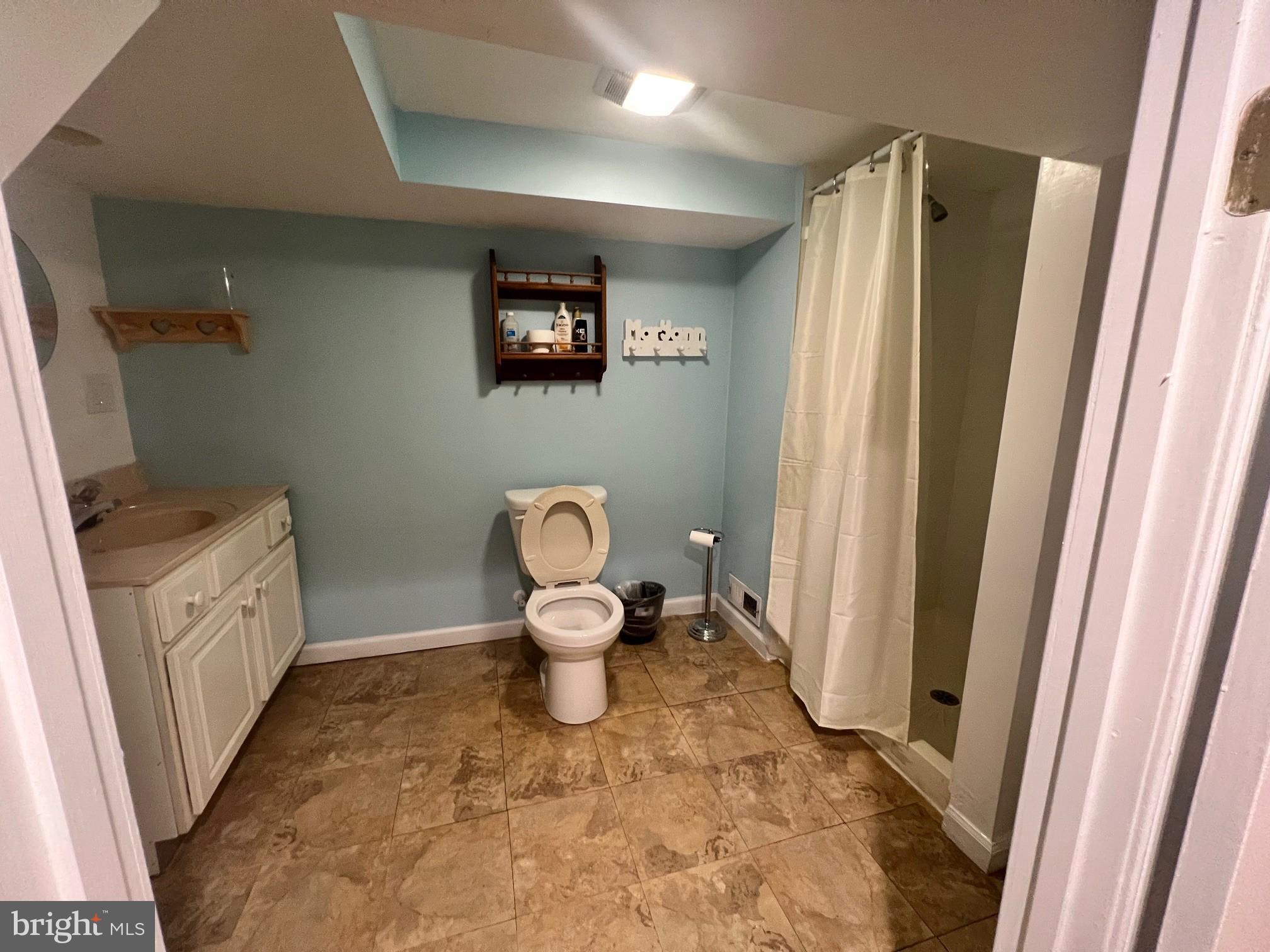 1355 Harding Highway Newfield, NJ 08344 - Photo 17 of 18 a bathroom with a sink and a toilet