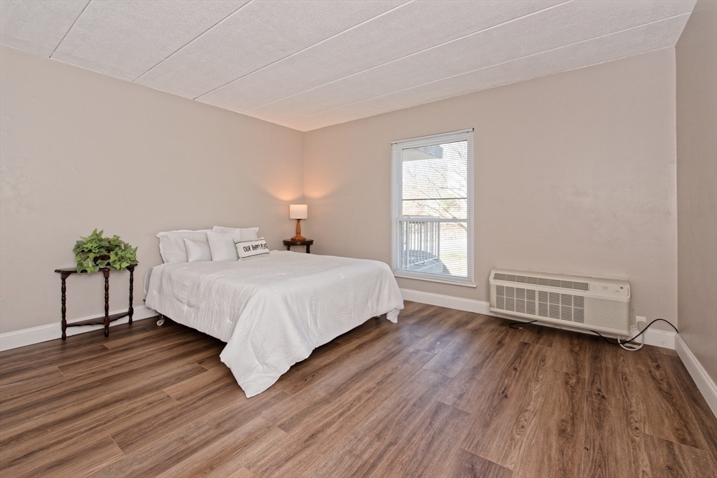 147 Turner Road, Unit 97 Holliston, MA 01746 - Photo 18 of 30 a bedroom with a bed and a window
