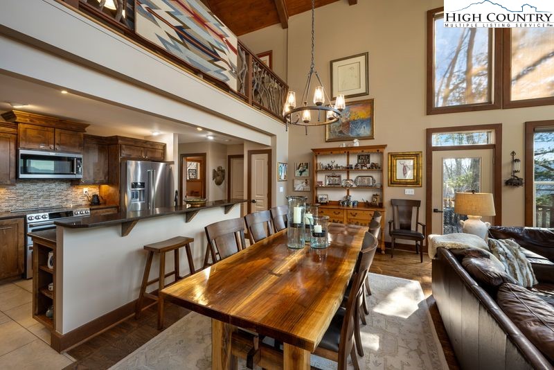 1155 Elk Ridge Road Ferguson, NC 28624 - Photo 11 of 46 a view of a dining room with furniture window and wooden floor