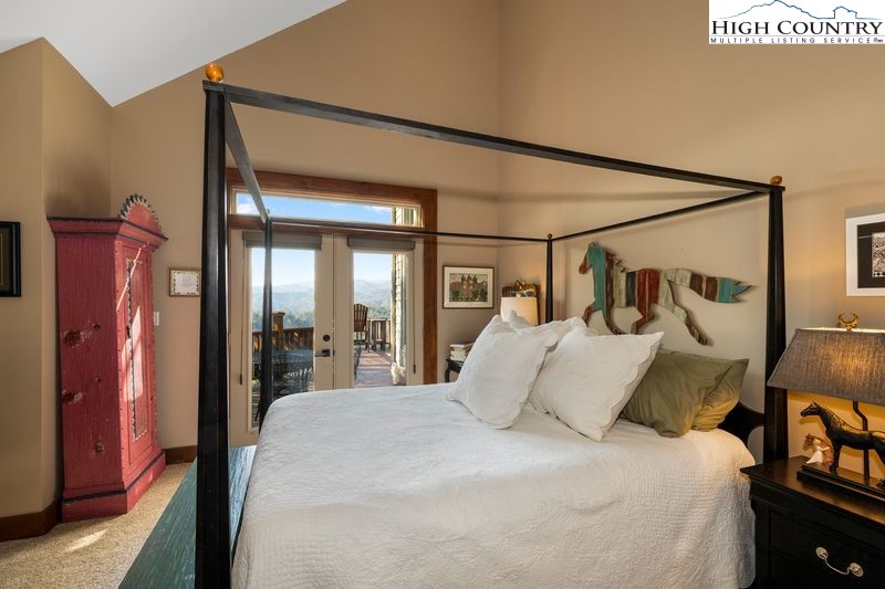 1155 Elk Ridge Road Ferguson, NC 28624 - Photo 25 of 46 a bed sitting in a bedroom next to a window