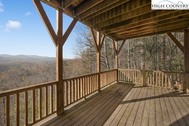 1155 Elk Ridge Road Ferguson, NC 28624 - Photo 31 of 46 a view of a balcony with wooden floor